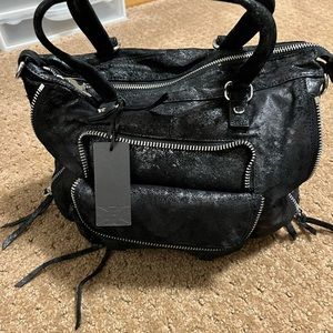 Beautiful black bag with silver handles and includes long strap never used